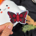 Sticker - Motte (schwarz/rot)